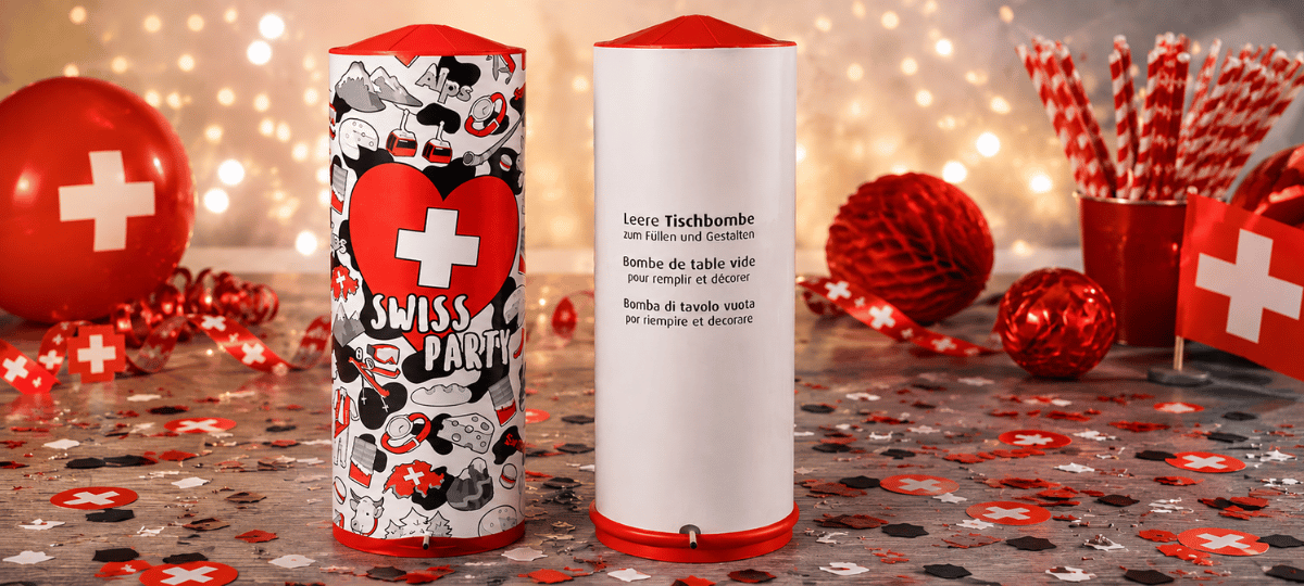 Dekorative Tischbomben im Schweizer Design und zum Selbstbefüllen, stilvoll präsentiert mit Konfetti und Schweizer Partydekoration auf festlichem Hintergrund.